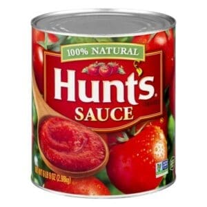 A can of sauce with tomatoes and meat inside.