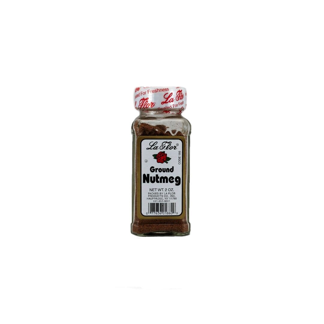 A bottle of ground nutmeg on a white background